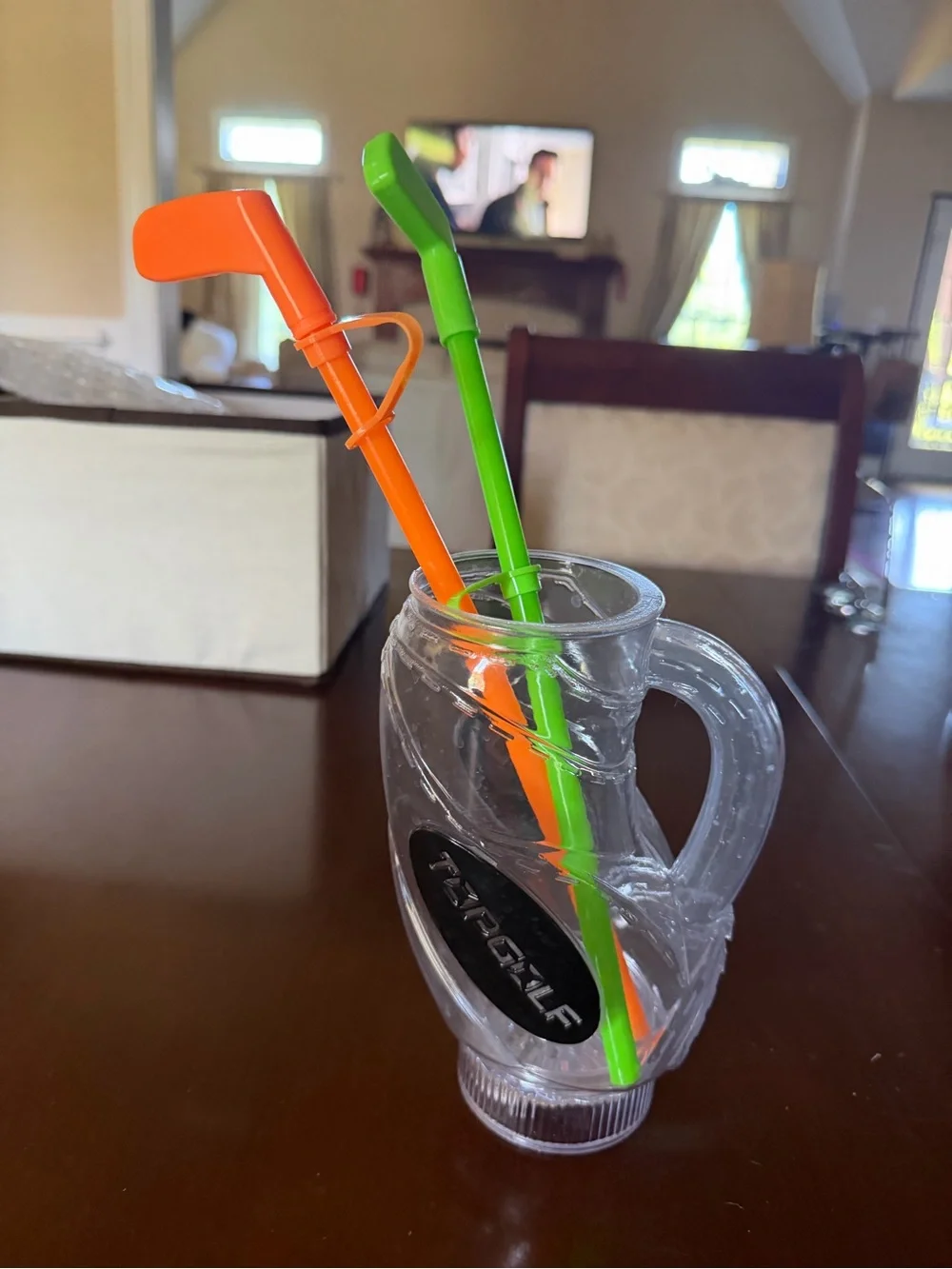 Topgolf plastic drink cup with Green and Orange Drink golf club straws